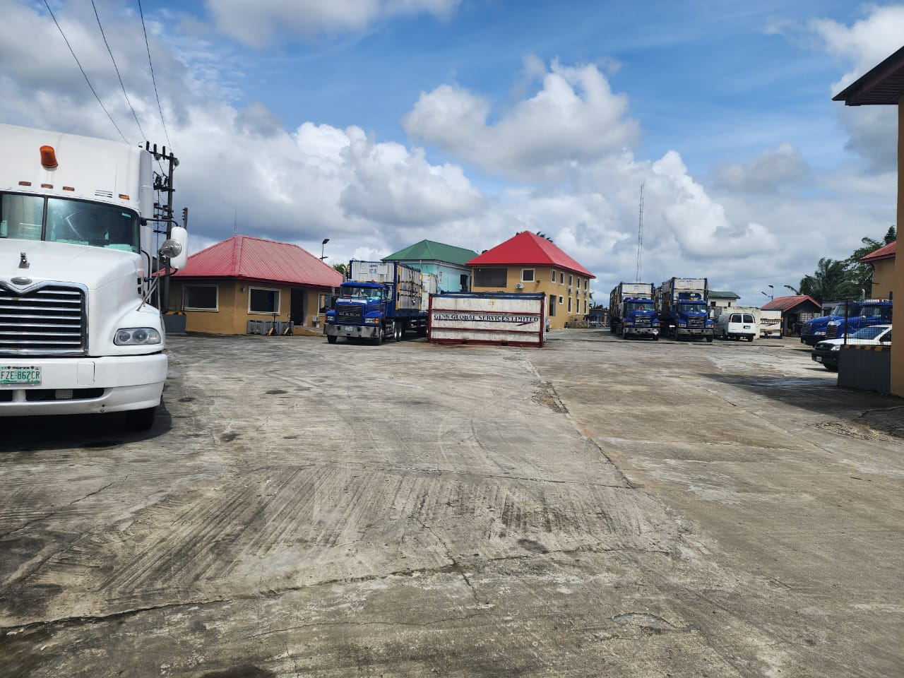 Operations base yard with Mack fleet, reefer units and administration blocks at Iriebe