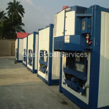 Row of offshore-rated reefer containers with impact-protection framing