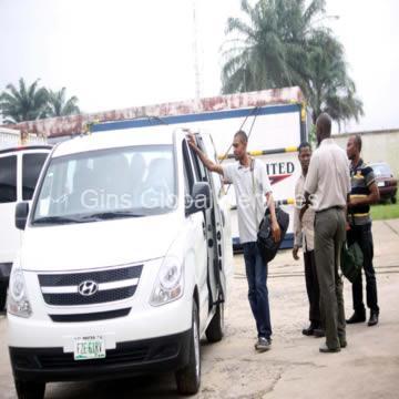 Field crew boarding the company shuttle van at the operations base