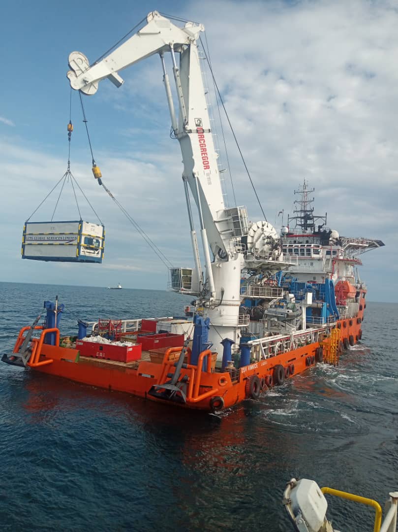 Gins Global Services Limited reefer container being lifted by a MacGregor offshore crane onto a dive support vessel